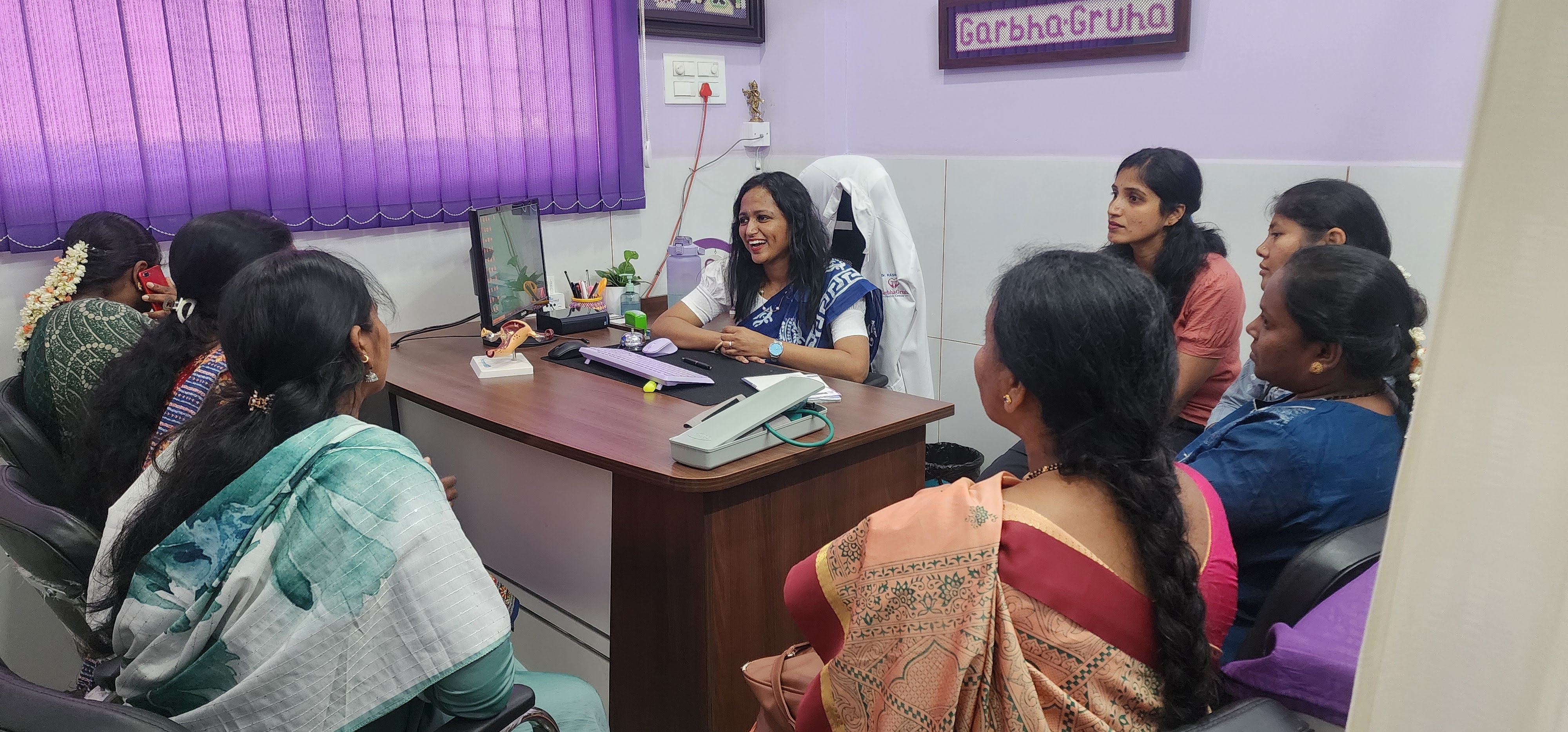 Dr. Rashmi T N with patients at GarbhaGruha Health Center Bangalore
